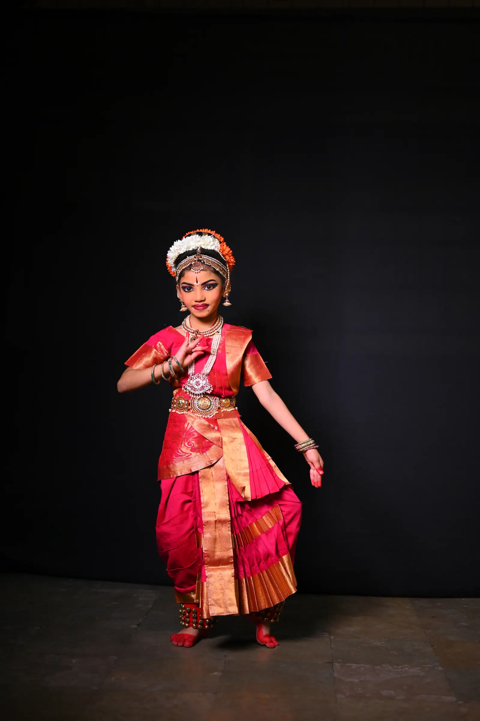 A Kuchipudi dancer in pink costume