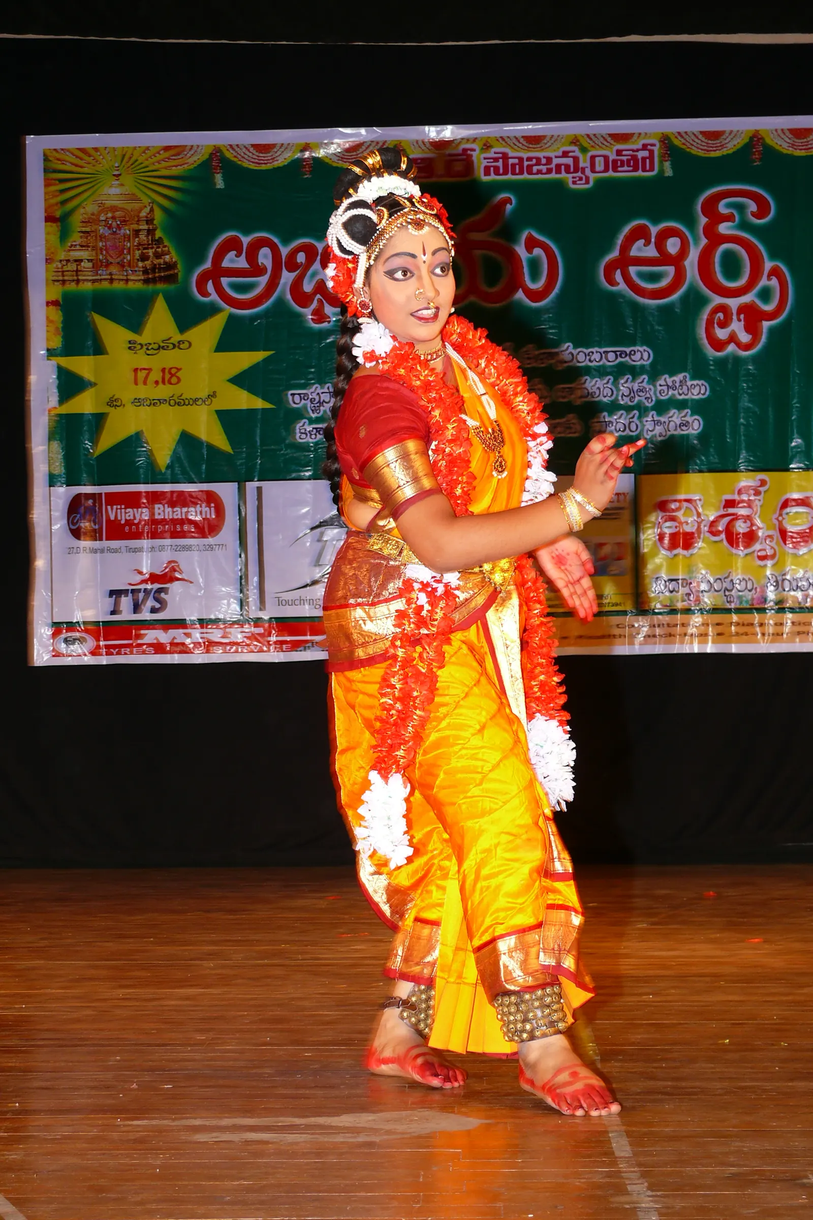 A young Kuchipudi dancer performing at a cultural programme