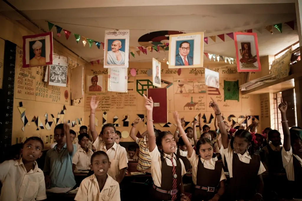 Students raising their hands in class